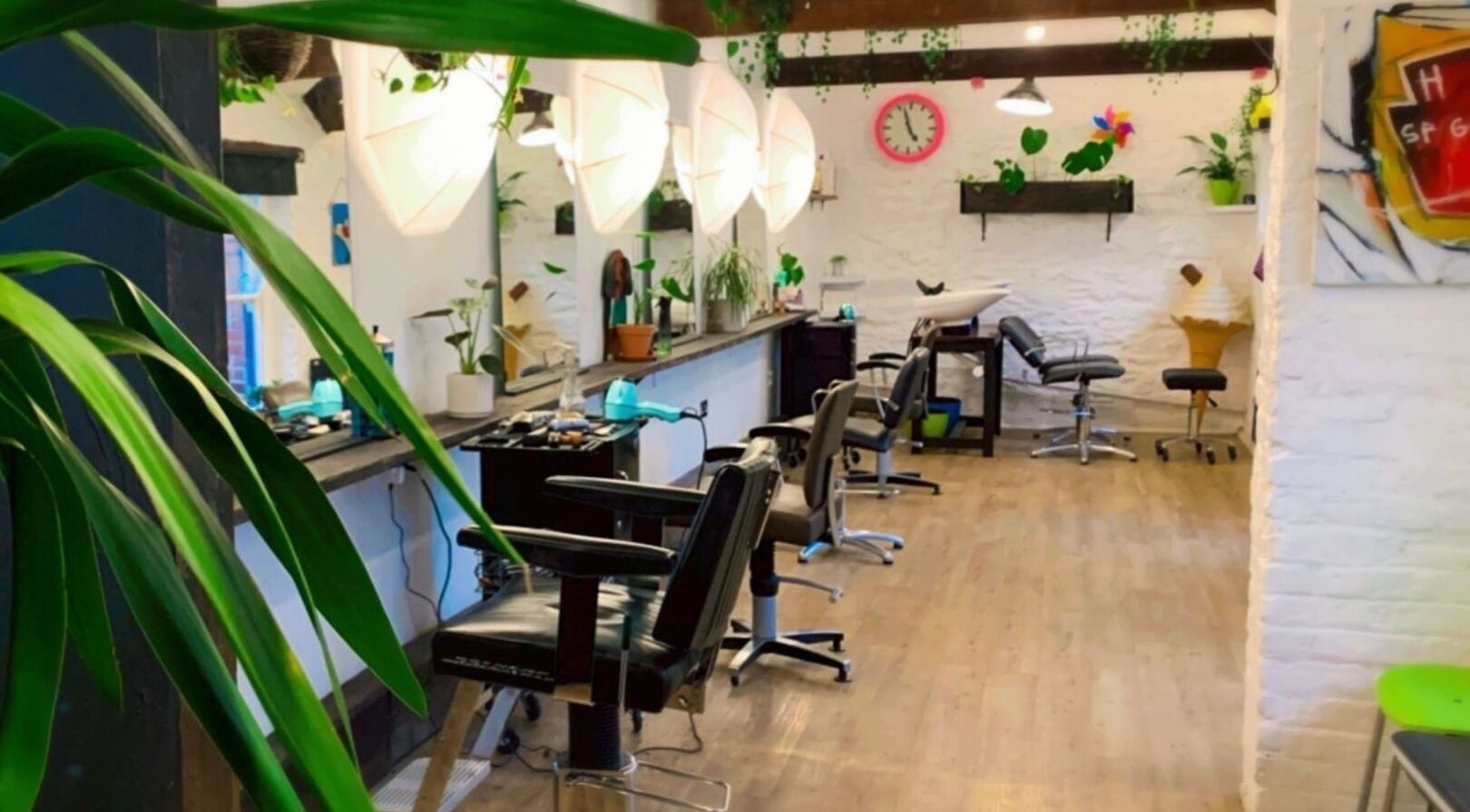 Modern salon interior at Lissybeth Hair @ Hybrid, Truro, England, GB with stylish decor and comfortable seating.