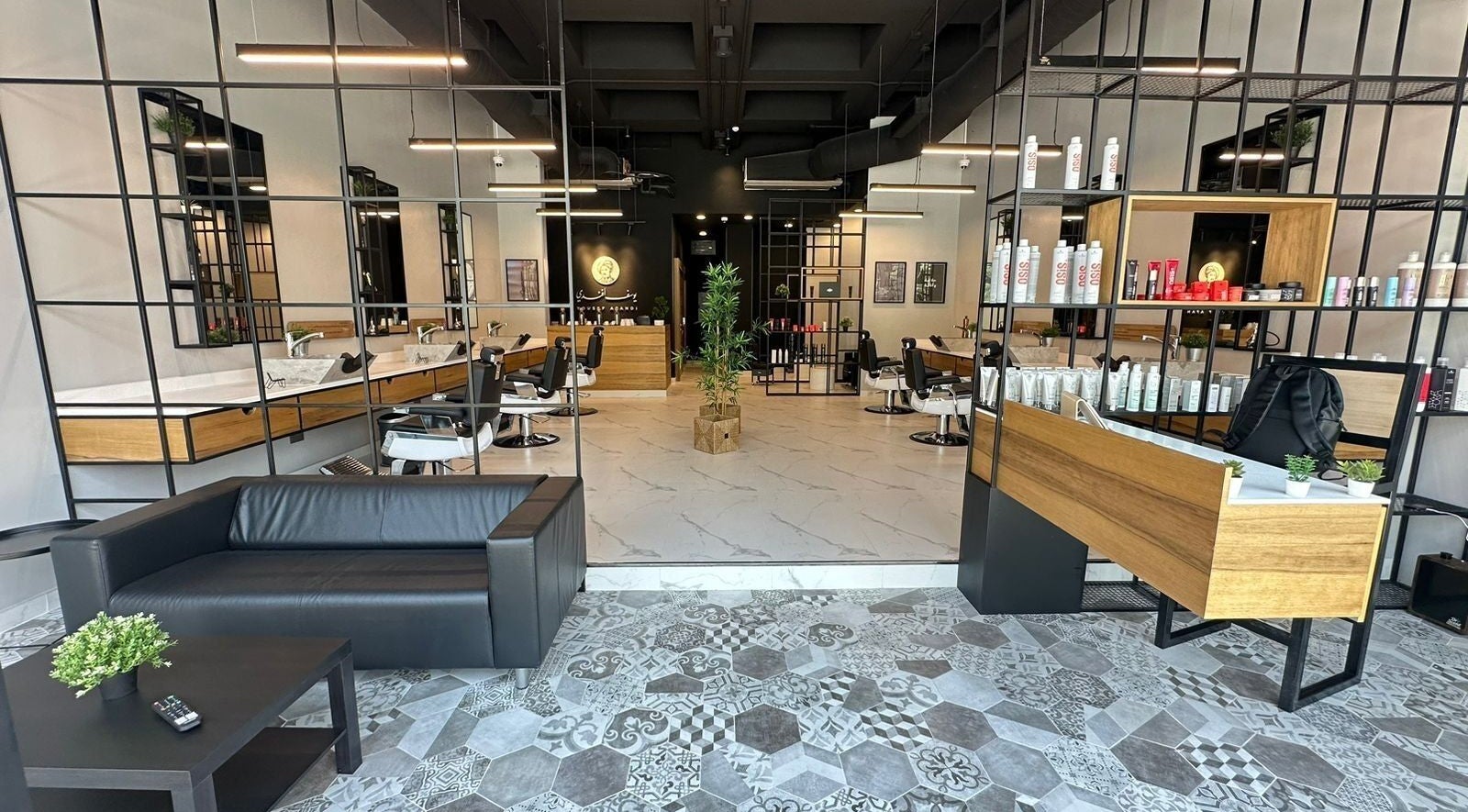 Stylish interior of Yousef Afandi Barbershop - Al Rabwa, showcasing chic decor in Riyadh, Riyadh Province, SA.