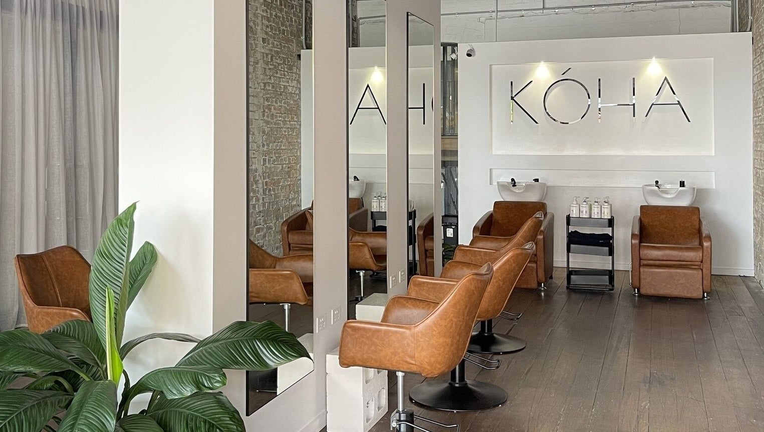 Kòha The Salon DAISY HILL, a stylish salon in Daisy Hill, Queensland, AU with modern decor and leather chairs.