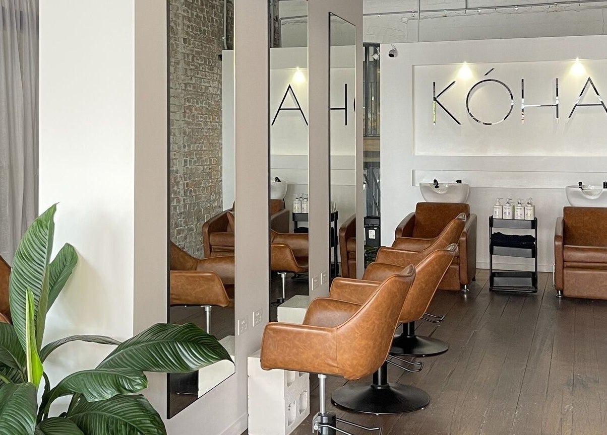 Kòha The Salon DAISY HILL, a stylish salon in Daisy Hill, Queensland, AU with modern decor and leather chairs.