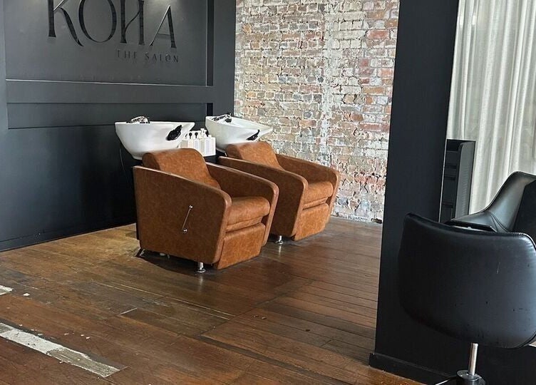 Stylish washing stations at Kòha The Salon DAISY HILL, Daisy Hill, Queensland, AU with exposed brick wall.