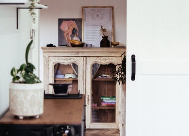 Elegant interior with vintage cabinet at Hair By Vanessa, Gisborne, Victoria, AU.