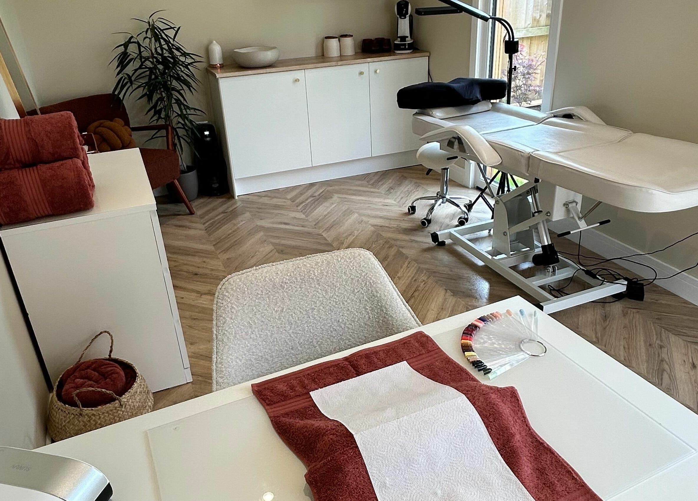 Relaxing treatment room at Beauty at Bullrush, Standish, England, GB, featuring a modern massage bed.