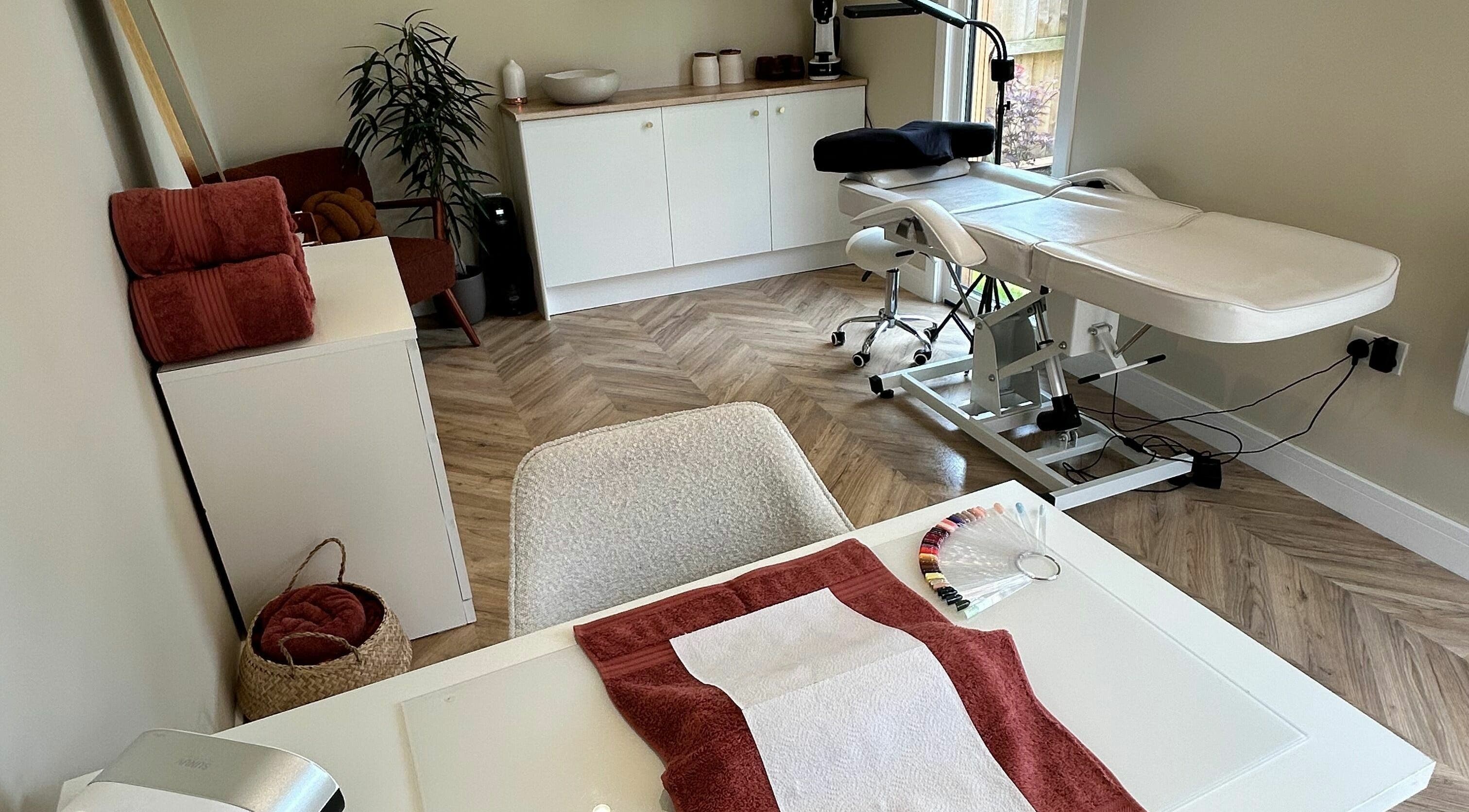 Relaxing treatment room at Beauty at Bullrush, Standish, England, GB, featuring a modern massage bed.