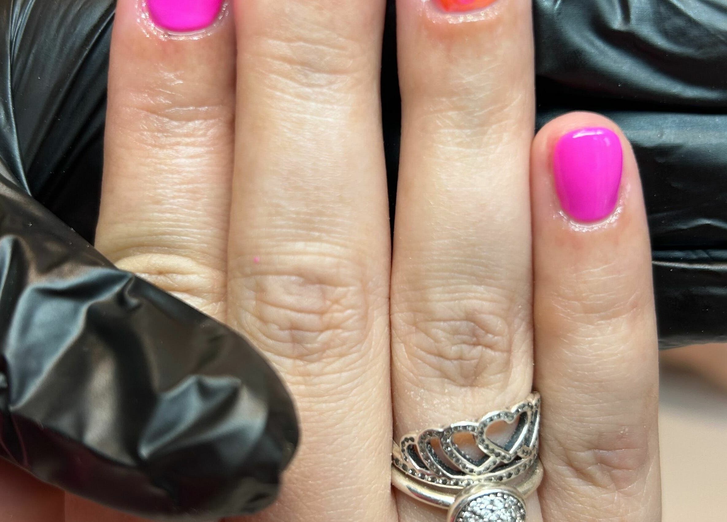 Manicure with vibrant pink nails at Beauty at Bullrush in Standish, England, GB.