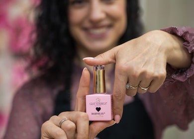 Geri Nails Art Studio in London, England, showcases a pink nail gel product.