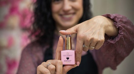 Geri Nails Art Studio in London, England, showcases a pink nail gel product.