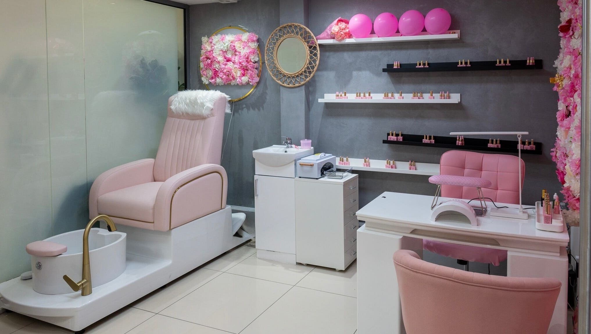 Geri Nails Art Studio in London, England, GB showcasing a chic pink manicure and pedicure setup.