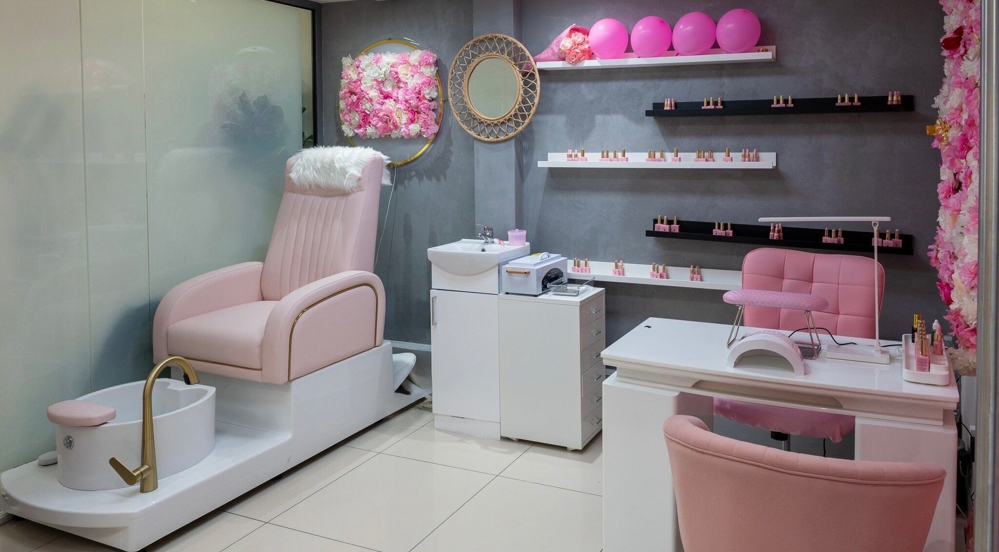 Geri Nails Art Studio in London, England, GB showcasing a chic pink manicure and pedicure setup.
