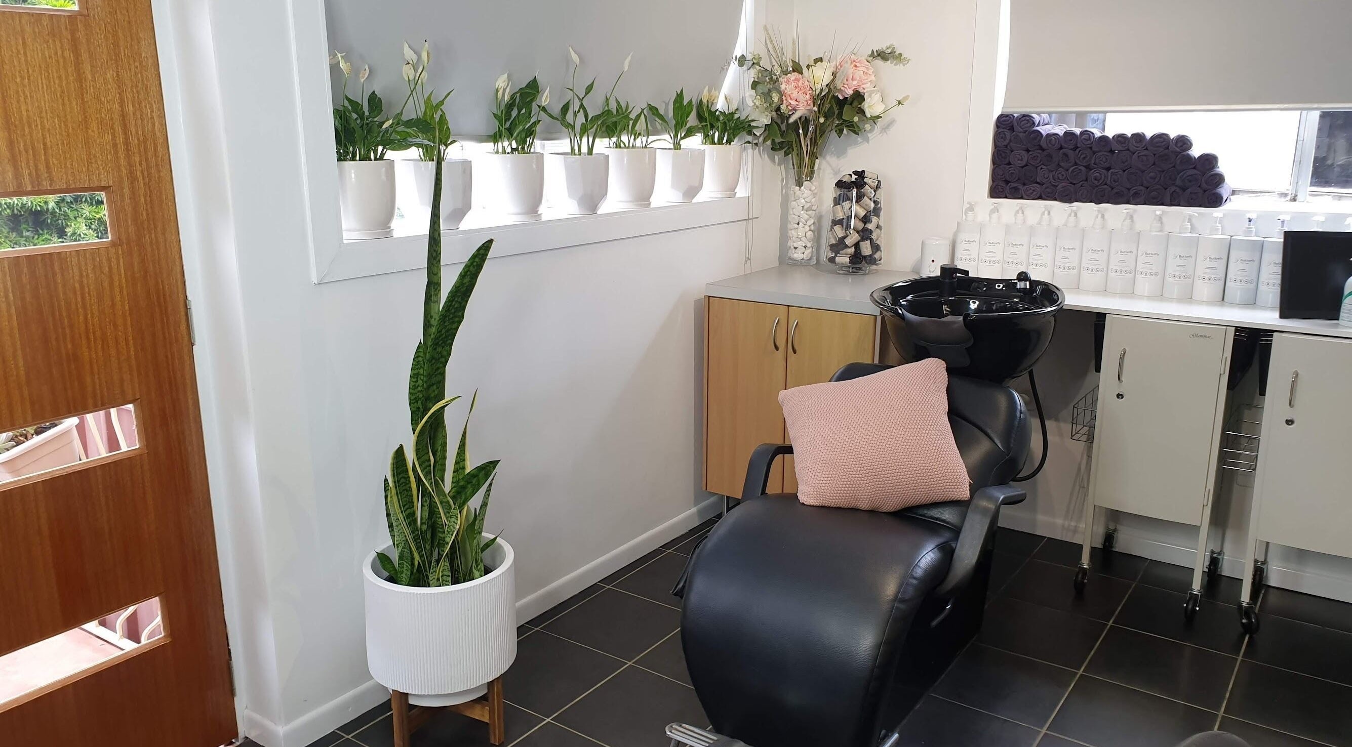 Tranquil salon corner at Butterfly Hair Studio in Strathpine, Queensland, AU, showcasing elegance and style.