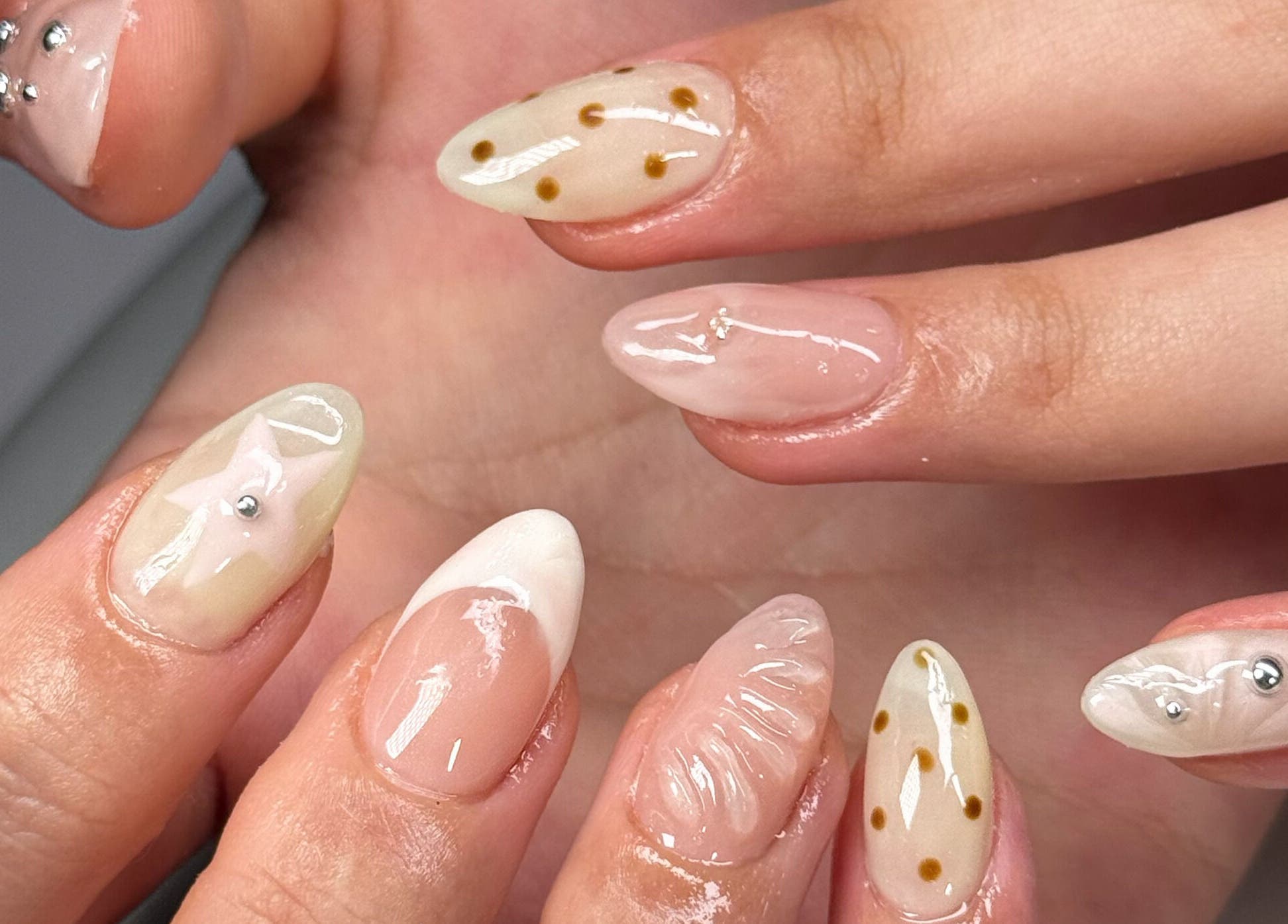 Unique designs on manicured nails at Kyo Nails, Auckland, Auckland, NZ, showcasing intricate art.