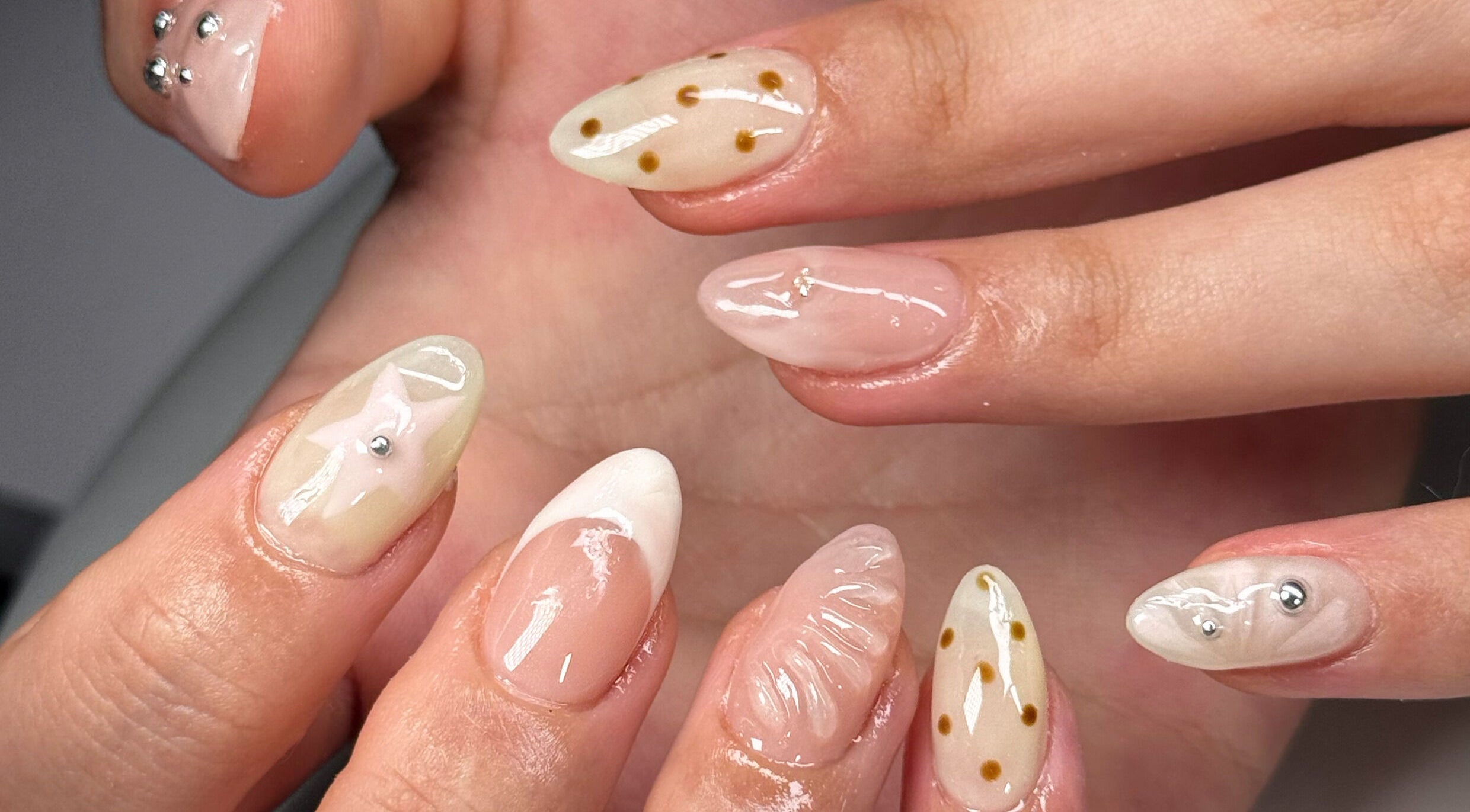 Unique designs on manicured nails at Kyo Nails, Auckland, Auckland, NZ, showcasing intricate art.