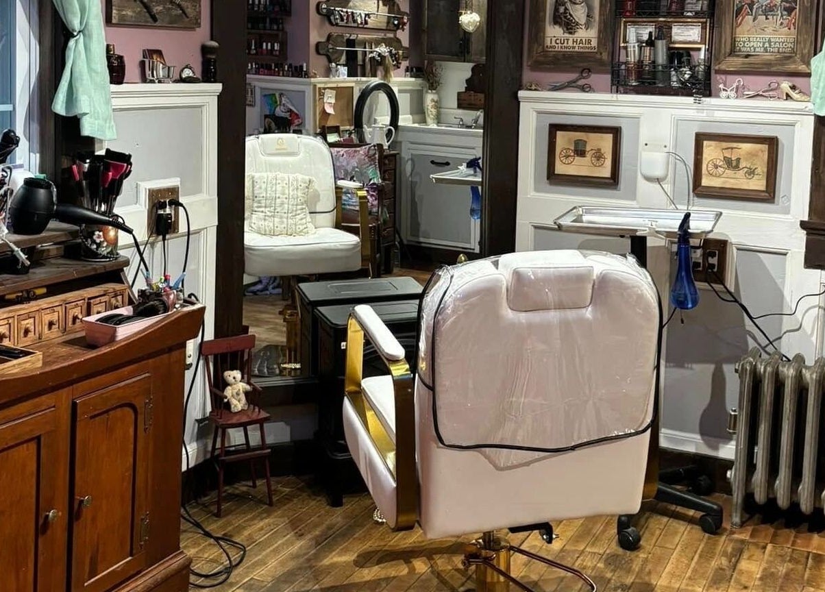 Interior of Jennifa Styles Hair Salon & Lounge in West Brookfield, MA, featuring elegant styling chairs and decor.