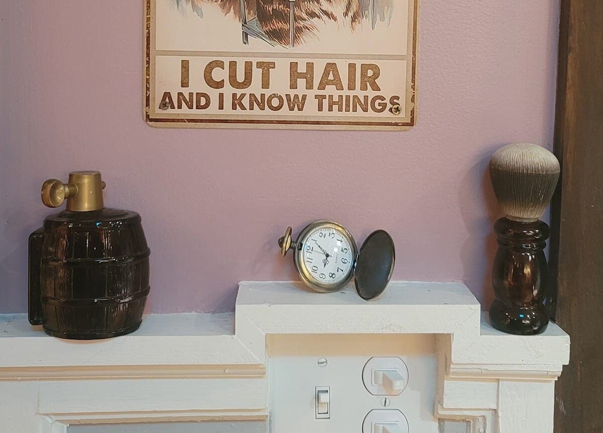Vintage barber sign and decor at Jennifa Styles Hair Salon & Lounge in West Brookfield, Massachusetts, US.