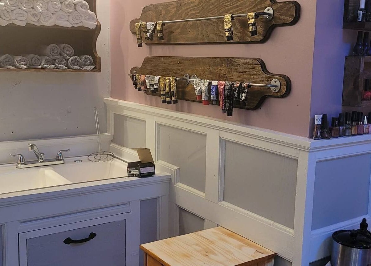 Organized nail products at Jennifa Styles Hair Salon & Lounge in West Brookfield, Massachusetts, US.