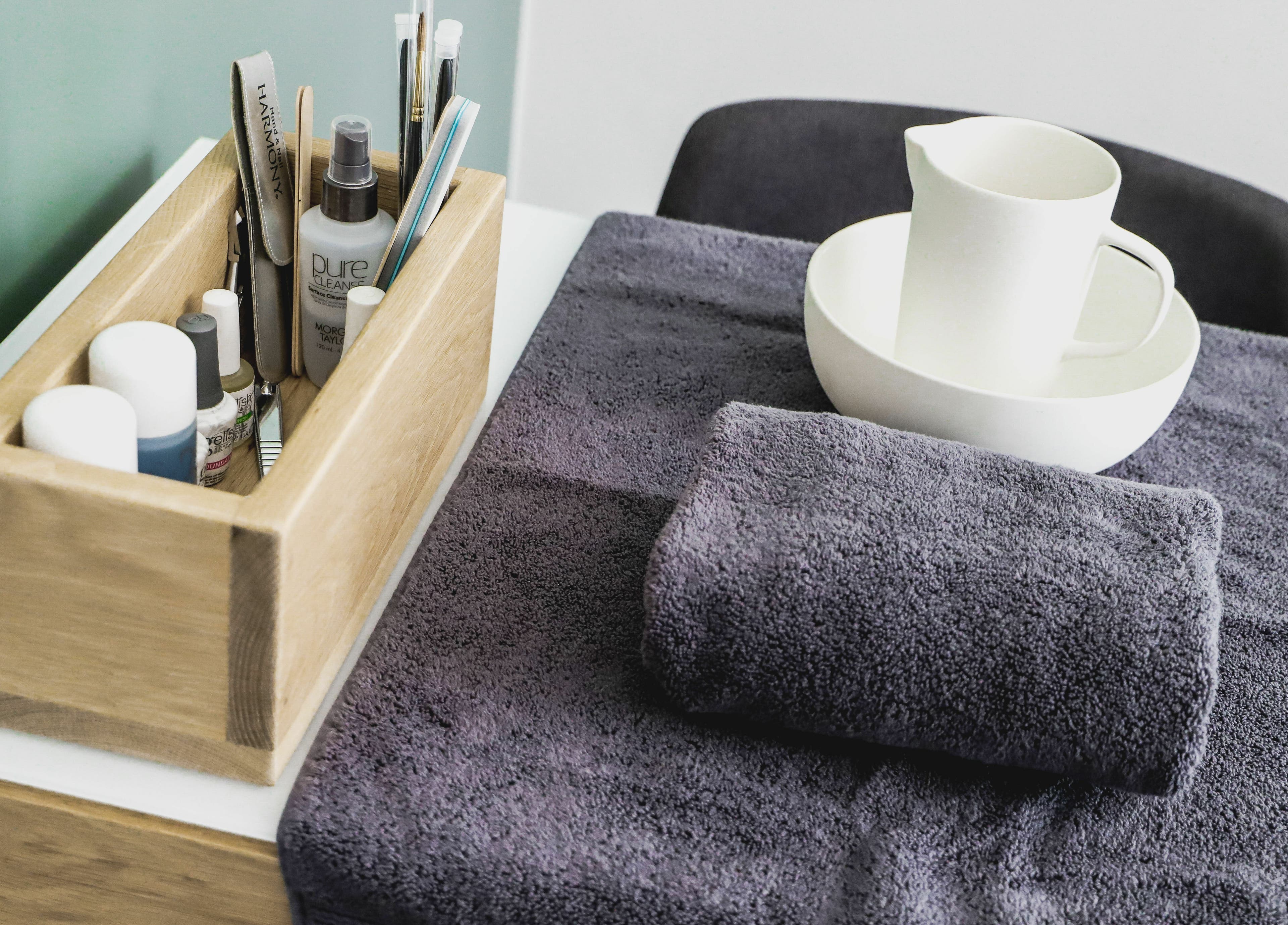 Beauty tools and towels at Meraki Aesthetics, Cape Town, Western Cape, ZA for a serene spa experience.