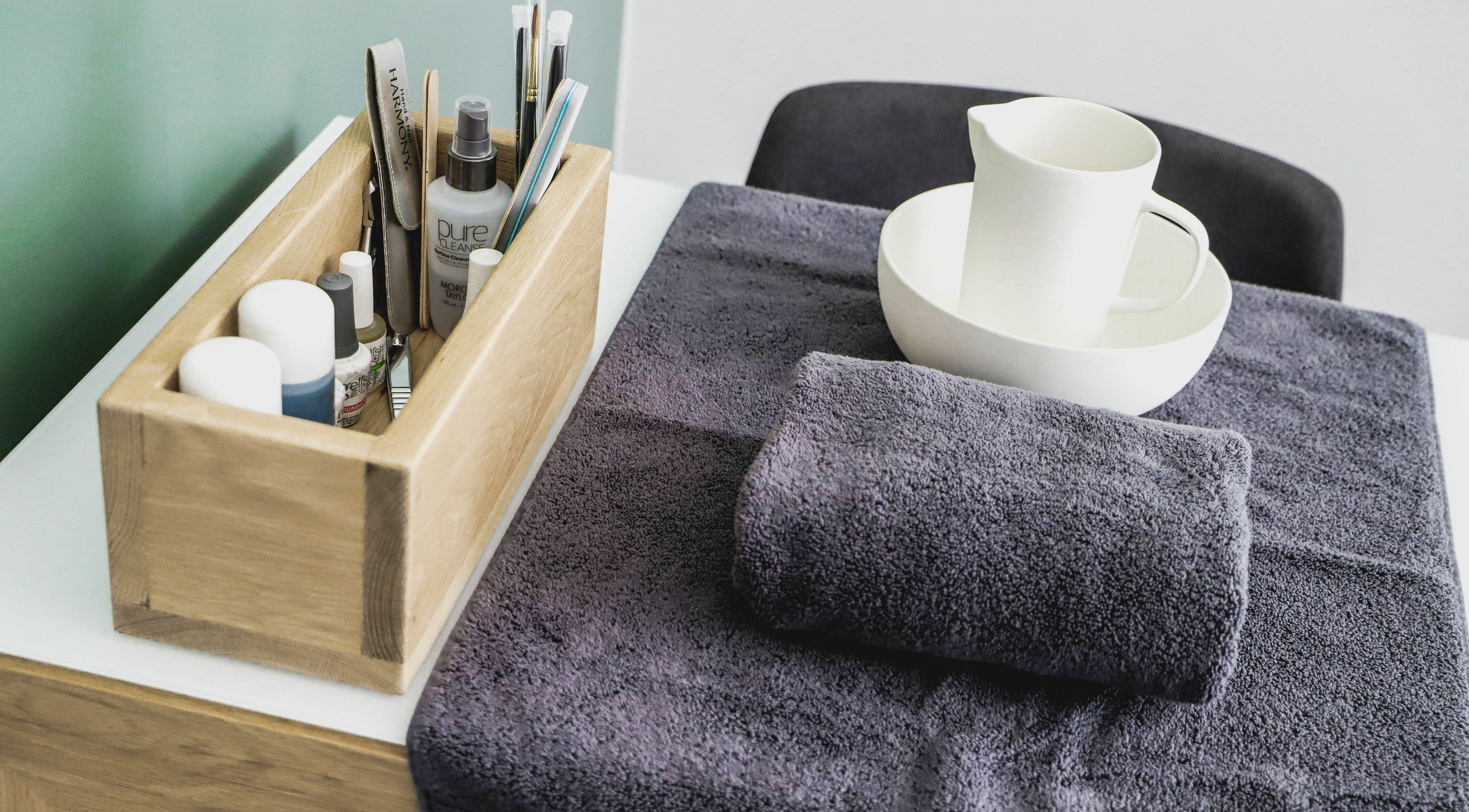 Beauty tools and towels at Meraki Aesthetics, Cape Town, Western Cape, ZA for a serene spa experience.