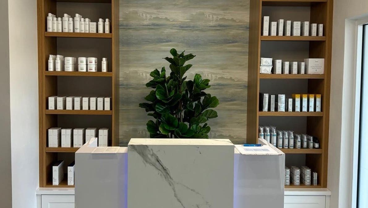 Reception at Live Well Aesthetics, Nassau, New Providence, BS featuring elegant product display shelves.