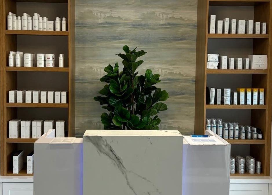 Reception at Live Well Aesthetics, Nassau, New Providence, BS featuring elegant product display shelves.