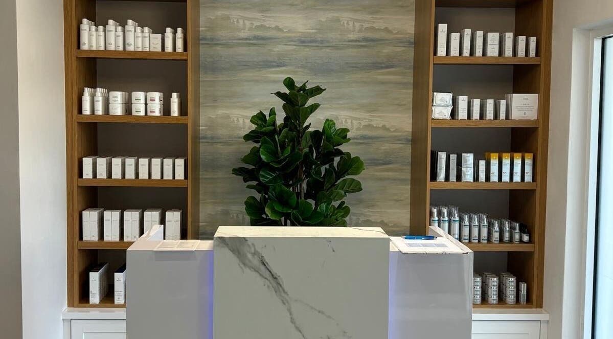 Reception at Live Well Aesthetics, Nassau, New Providence, BS featuring elegant product display shelves.