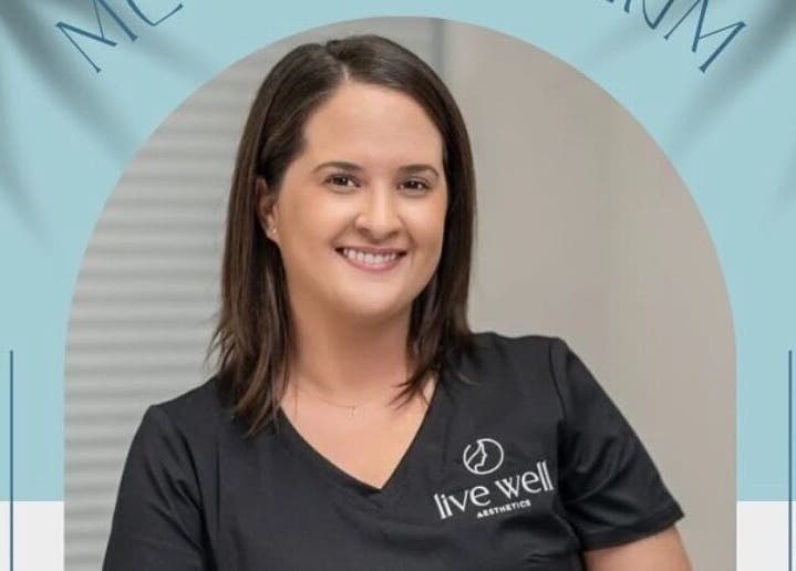 Smiling staff member at Live Well Aesthetics, Nassau, New Providence, BS, showcasing friendly service.