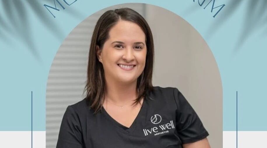 Smiling staff member at Live Well Aesthetics, Nassau, New Providence, BS, showcasing friendly service.