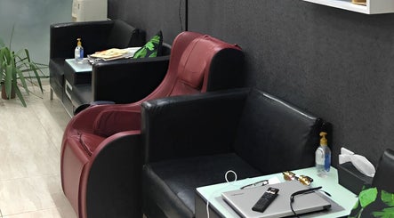 Stylish seating area at Al Lord Barber Shop, Muscat, Muscat Governorate, OM, showcasing modern decor.