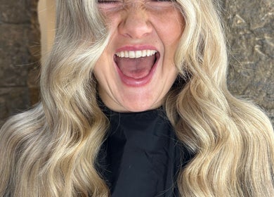 Happy client with wavy blonde hair at Blondes & Brondes By Beth, East Kilbride, Scotland, GB.