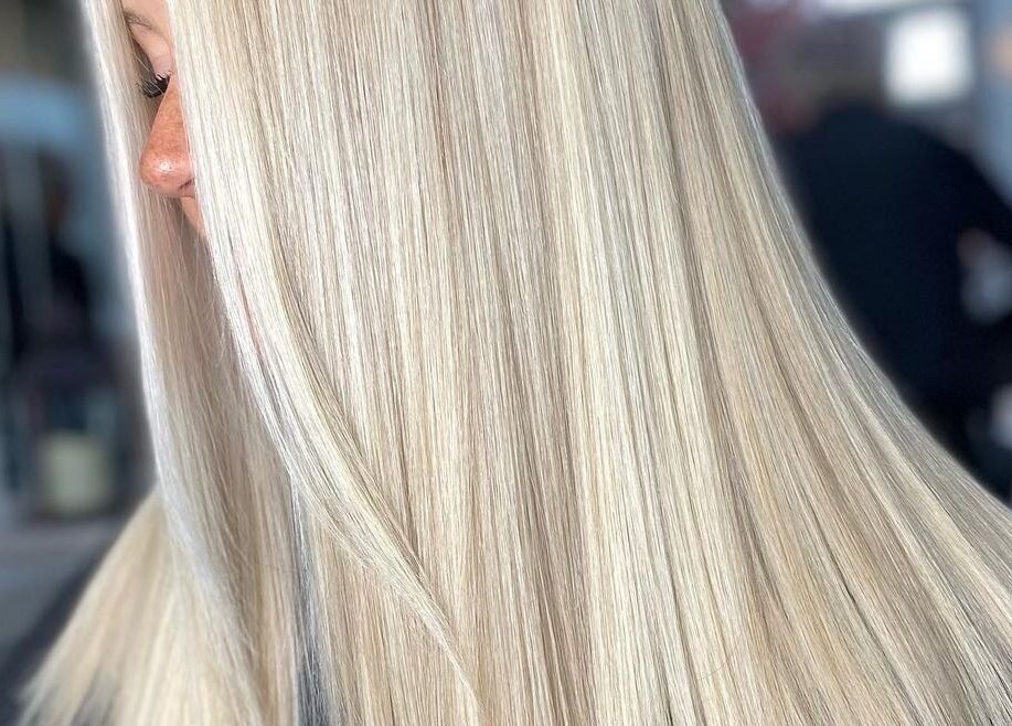 Sleek blonde hair styling at Blondes & Brondes By Beth, East Kilbride, Scotland, GB. Perfectly smooth strands.