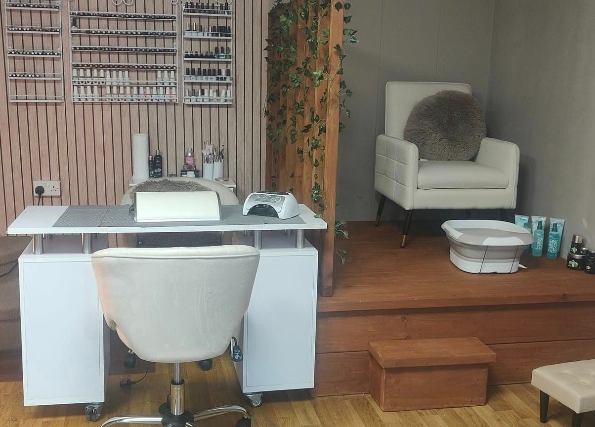 Nail and pedicure station at Oh La Lash and Beauty, Llanelli, Wales, GB, featuring elegant seating and decor.