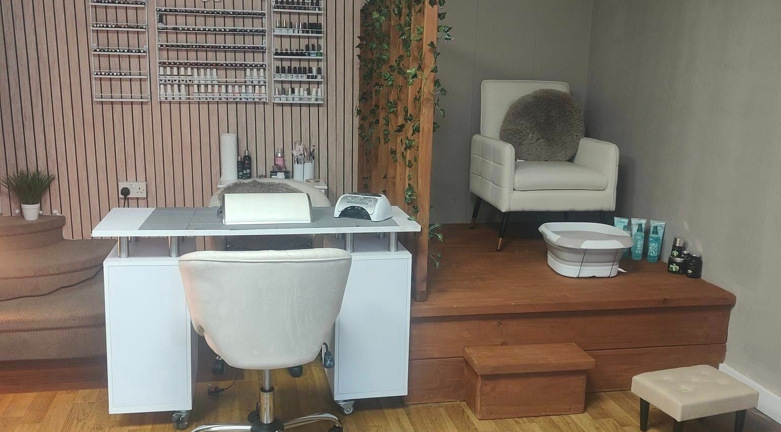 Nail and pedicure station at Oh La Lash and Beauty, Llanelli, Wales, GB, featuring elegant seating and decor.