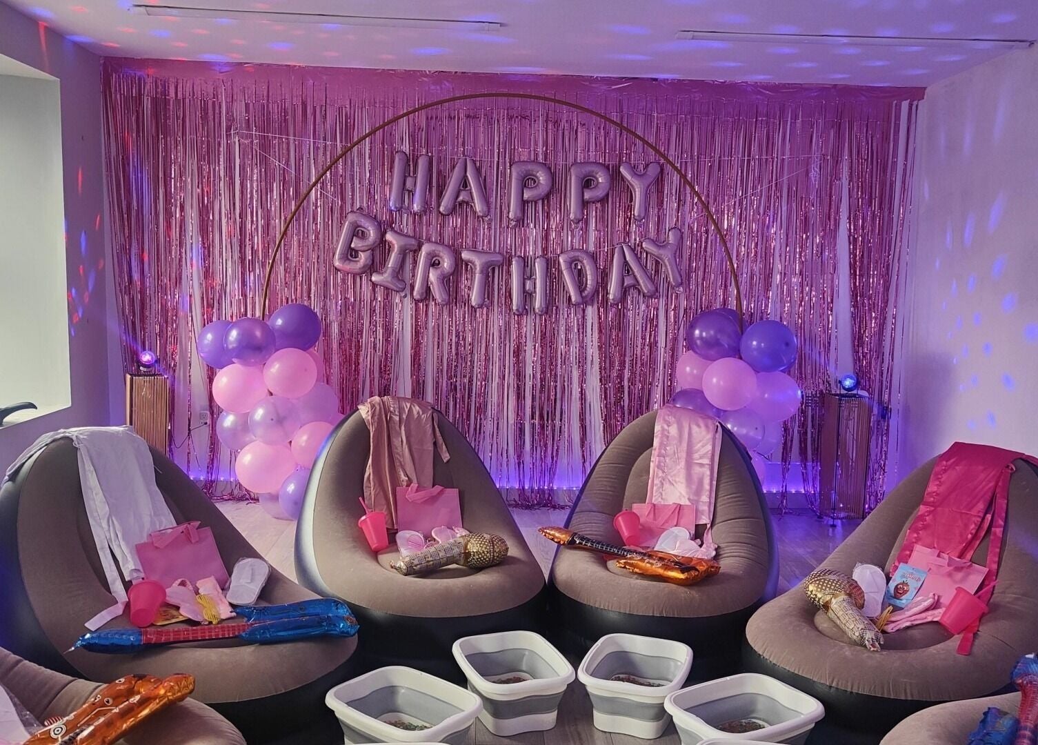 Birthday party setup at Oh La Lash and Beauty, Llanelli, Wales, GB with chic chairs and festive decor.