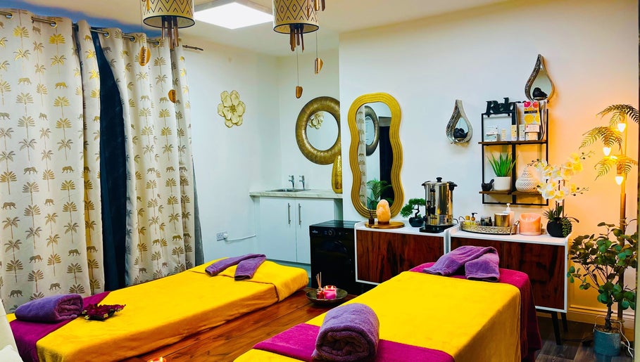 Peaceful massage room at Sawan Thai Massage Halifax, England, GB with warm lighting and colorful decor.