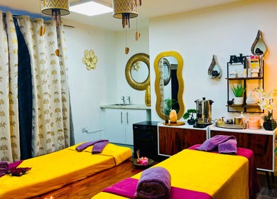 Peaceful massage room at Sawan Thai Massage Halifax, England, GB with warm lighting and colorful decor.