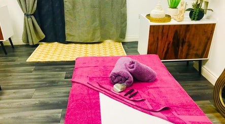 Relaxing massage setup at Sawan Thai Massage Halifax in Halifax, England, GB with pink towels and decor.