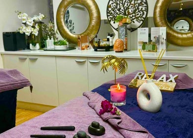 Relaxing massage room at Sawan Thai Massage Halifax, England, GB with plush towels and calming decor.
