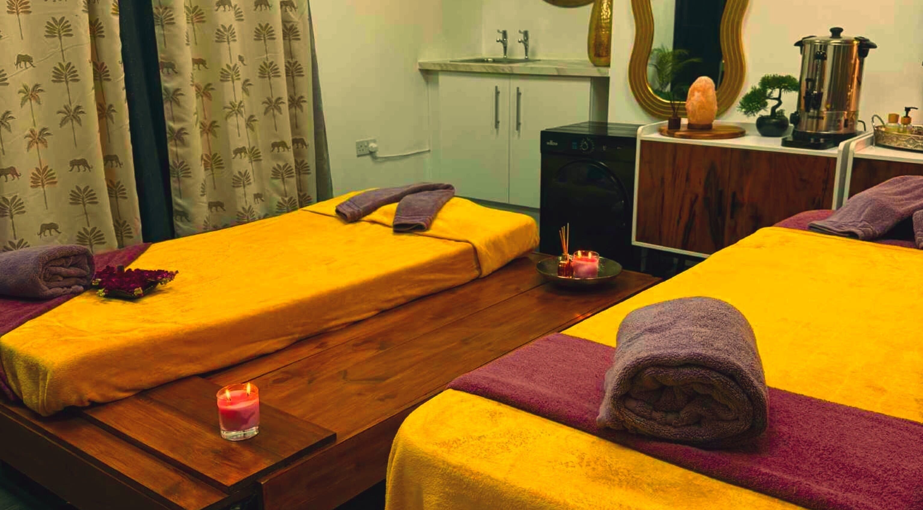 Relaxing massage room at Sawan Thai Massage Halifax, Halifax, England, GB, with cozy yellow and purple decor.