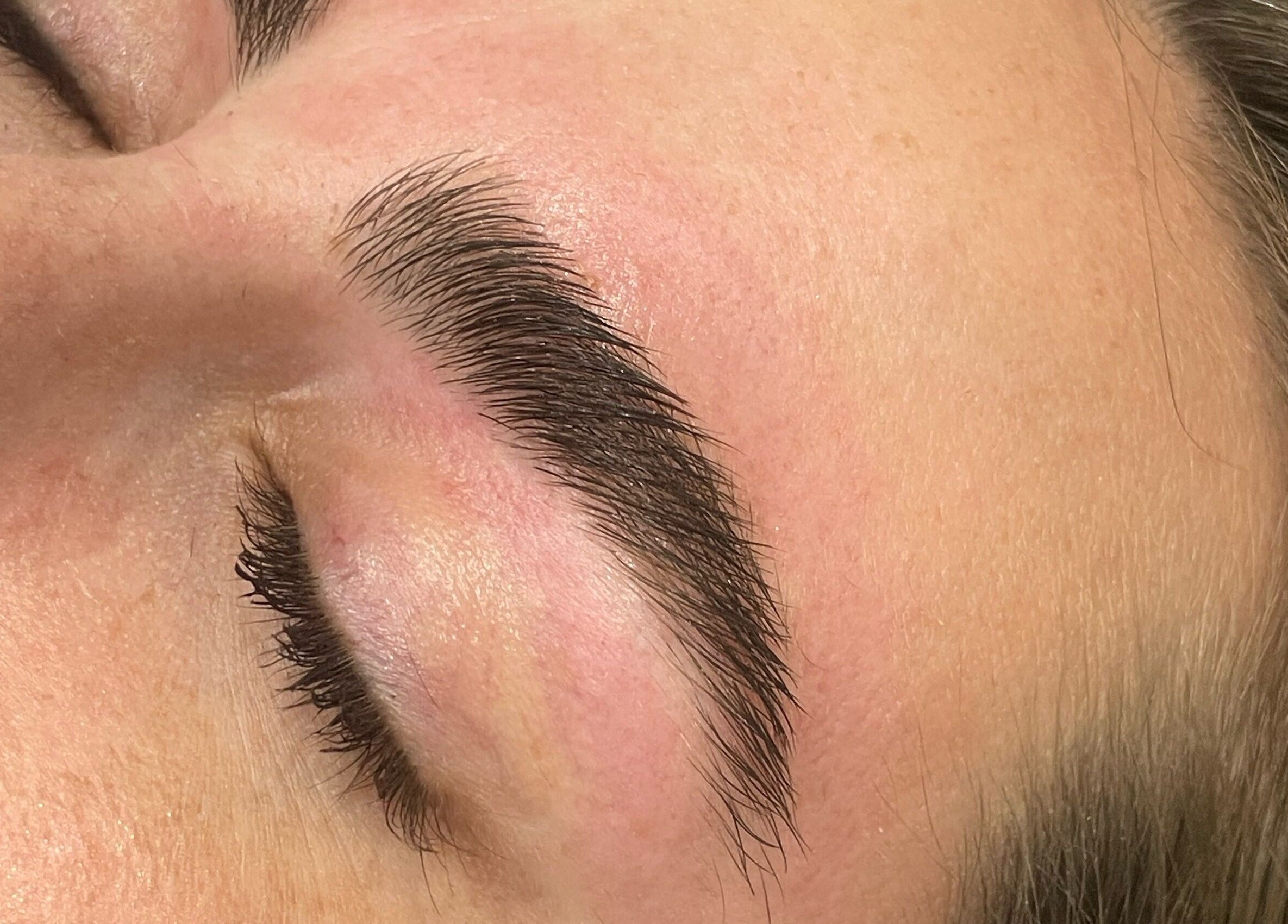 Close-up of expertly shaped eyebrows at Mollie Langston Brows, Fulham, South Australia, AU.