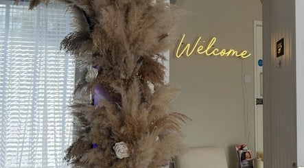 Welcome sign with pampas and flowers at By Tia Maria Beauty @ The Filler Club, Farnborough, England, GB.