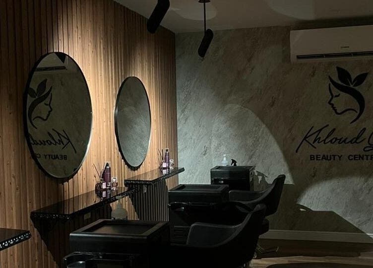 Interior of Kholoud Beauty I مركز خلود بيوتي, Dammam, features elegant mirrors and styling stations.