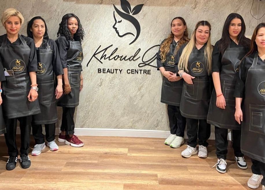 The team at Kholoud Beauty I مركز خلود بيوتي in Dammam, Eastern Province, SA, wearing branded aprons.