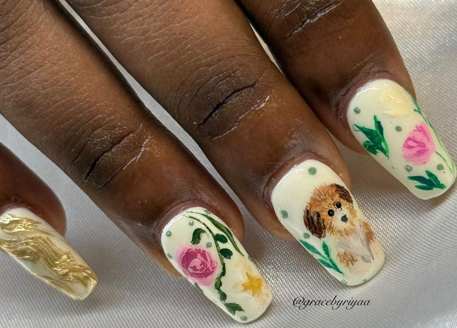 Intricate nail art design featuring flowers and a puppy at Grace By Riyaa, Shah Alam, Selangor, MY.
