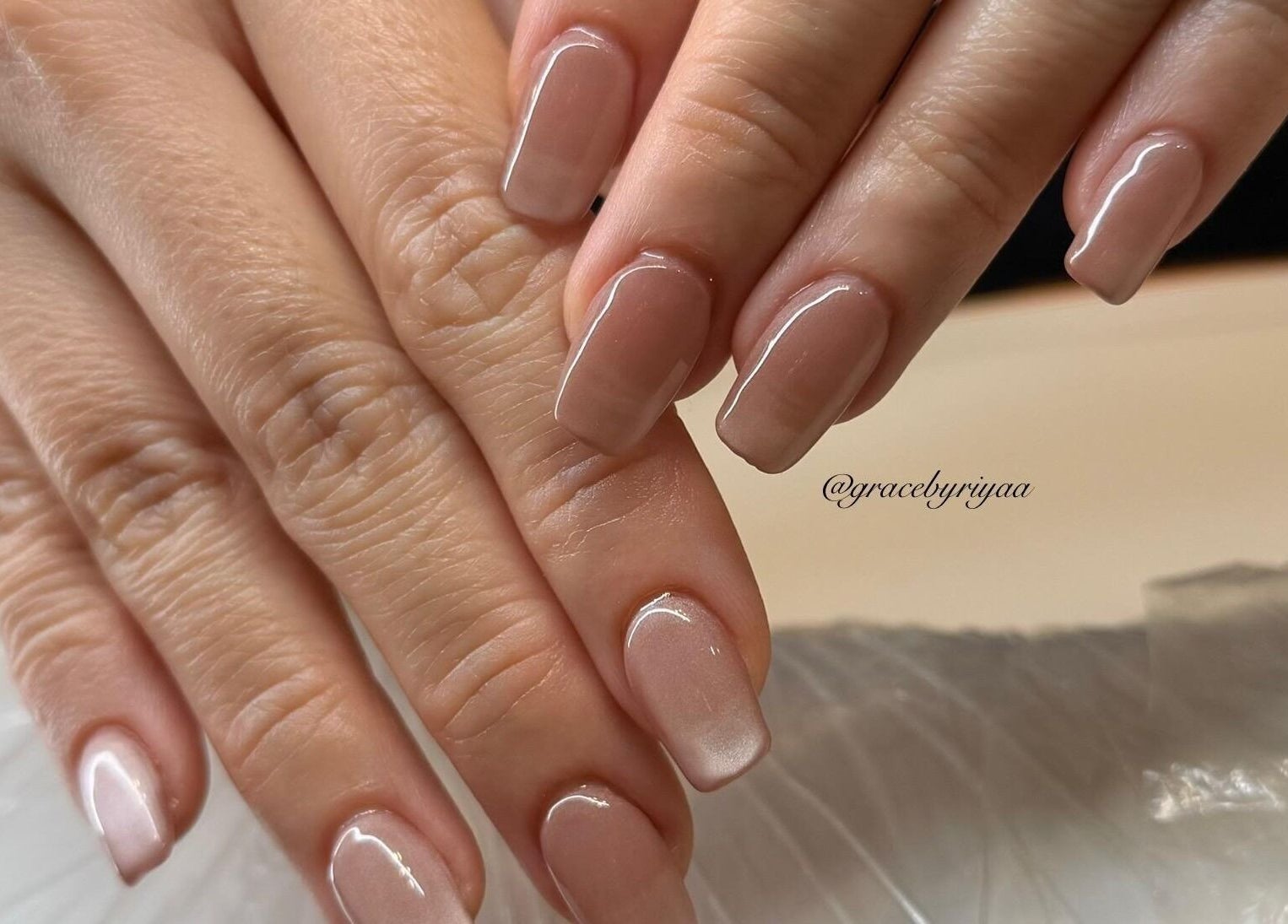 Elegant manicure at Grace By Riyaa, Shah Alam, Selangor, MY showcasing glossy nude nails.
