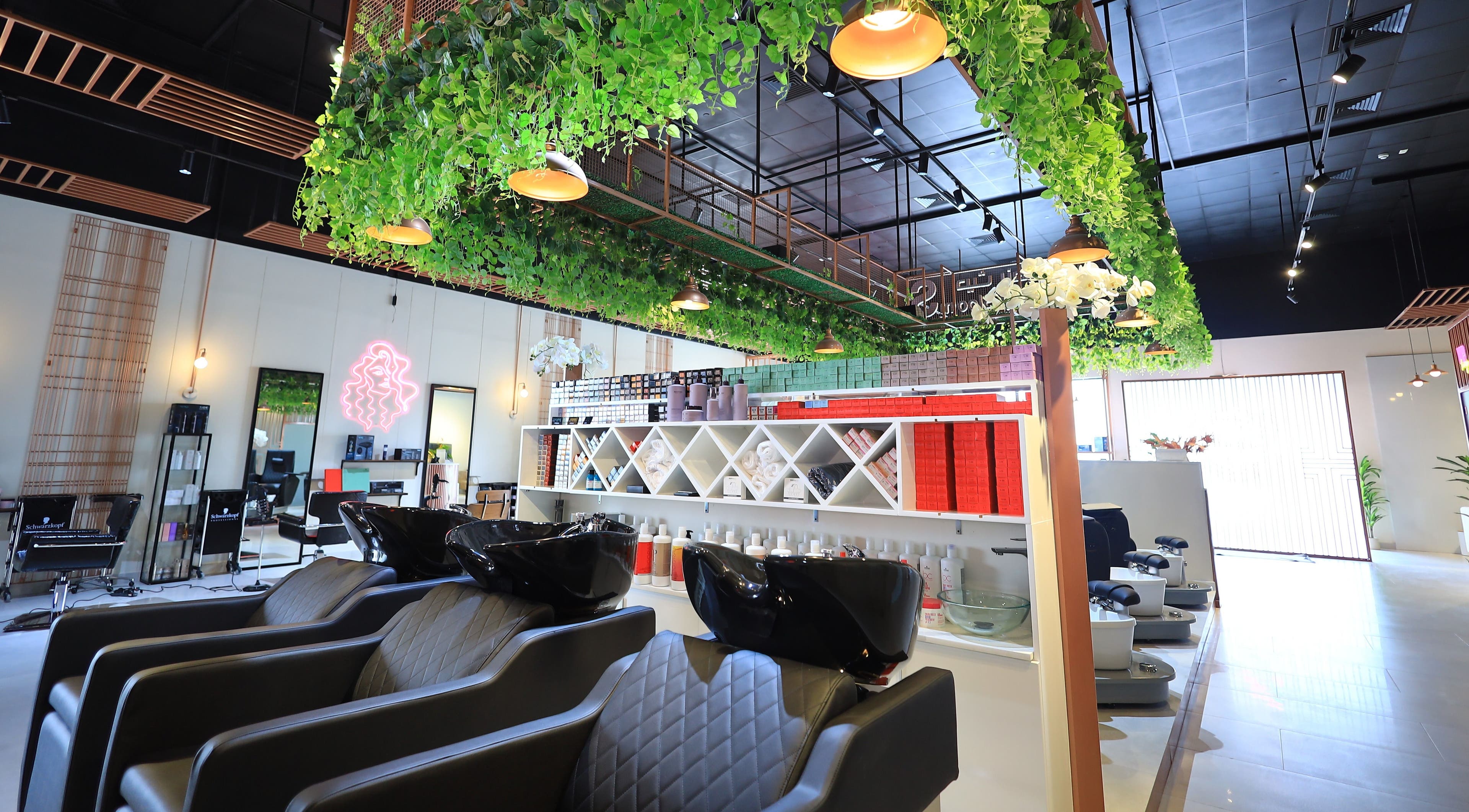 Chic salon interior with green decor at She Beauty Lounge, Ras Al-khaimah, Ras Al Khaimah, AE. Modern and inviting ambiance.