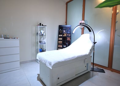 Luxurious treatment room at She Beauty Lounge, Ras Al-khaimah, Ras Al Khaimah, AE, featuring a comfortable bed.