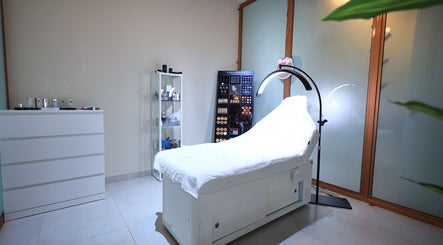 Luxurious treatment room at She Beauty Lounge, Ras Al-khaimah, Ras Al Khaimah, AE, featuring a comfortable bed.