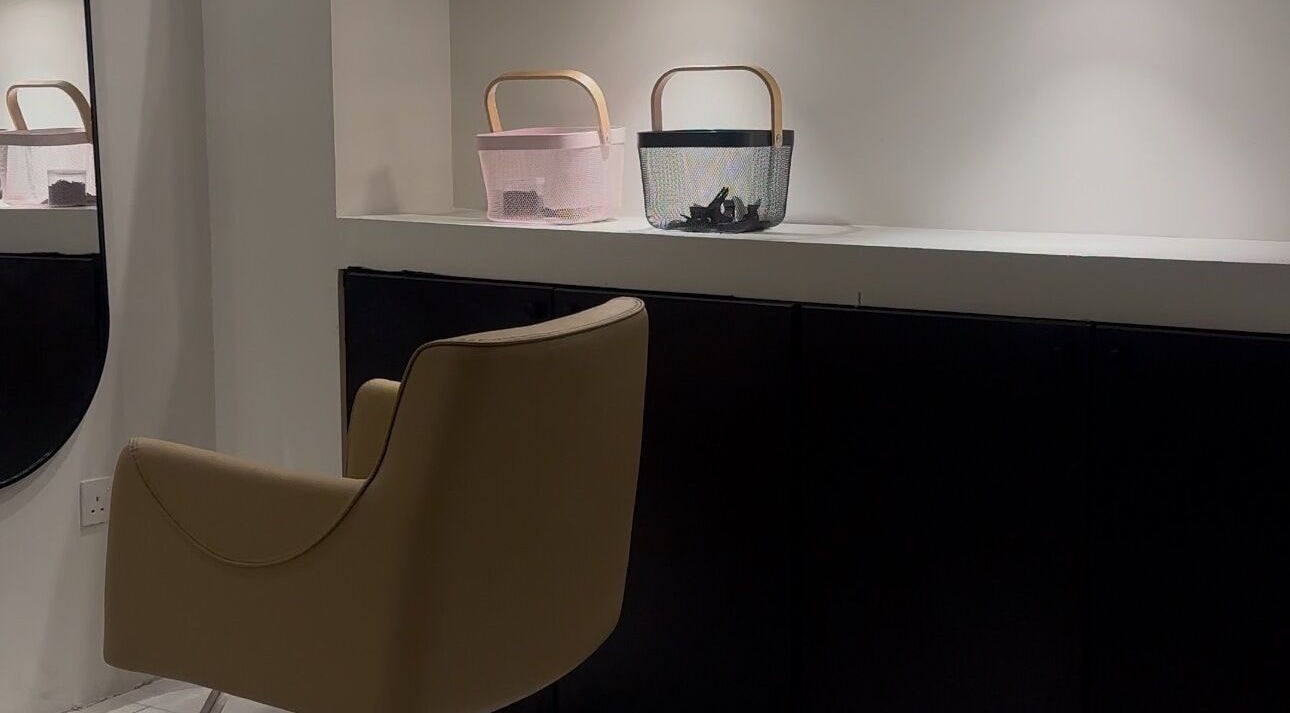 Stylish seating area at NAILAX | نيلاكس, Riyadh, Riyadh Province, SA, featuring modern chairs and decor.