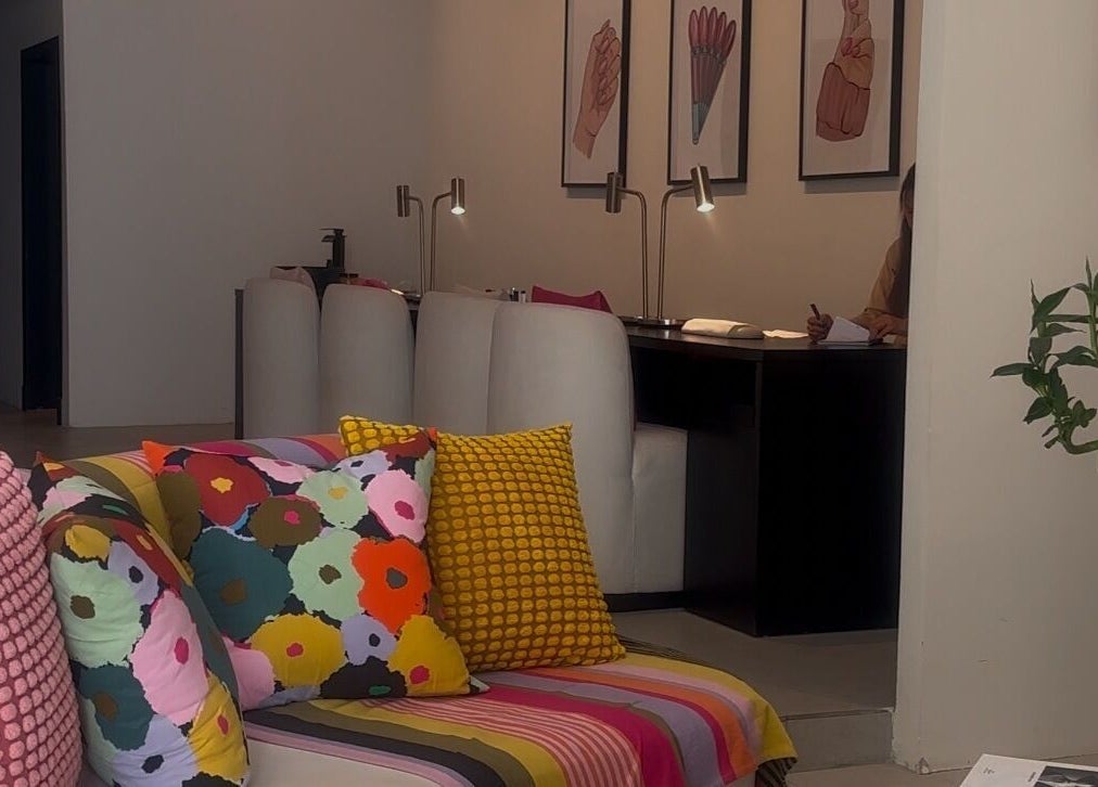 Colorful lounge area at NAILAX | نيلاكس in Riyadh, Riyadh Province, SA, showcasing bright cushions and stylish decor.