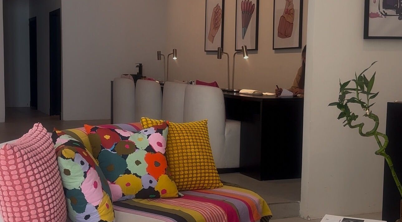 Colorful lounge area at NAILAX | نيلاكس in Riyadh, Riyadh Province, SA, showcasing bright cushions and stylish decor.