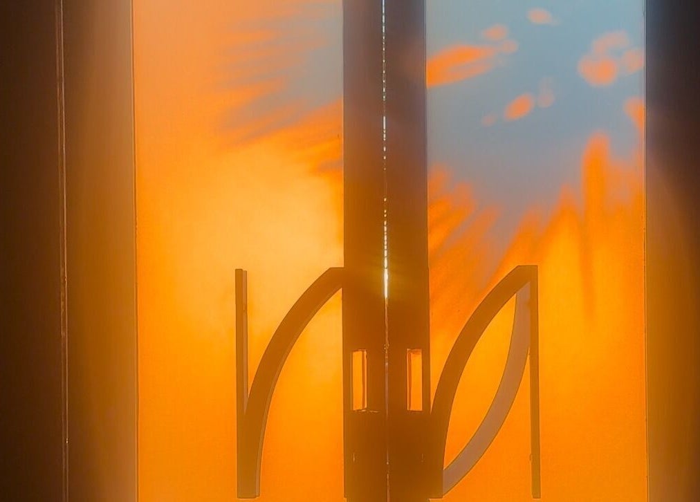 Warm sunlit design at NAILAX | نيلاكس entrance in Riyadh, Riyadh Province, SA, casting a vibrant glow.